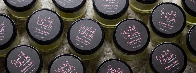 Multiple jars of Wild Chick Organics salve