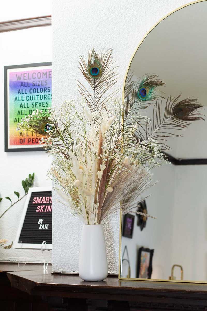 Peacock feather bouquet decoration inside Portland esthetician Kate's studio space