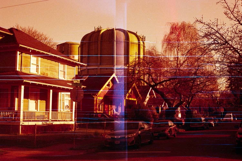 Redscale film photo of a neighborhood scene