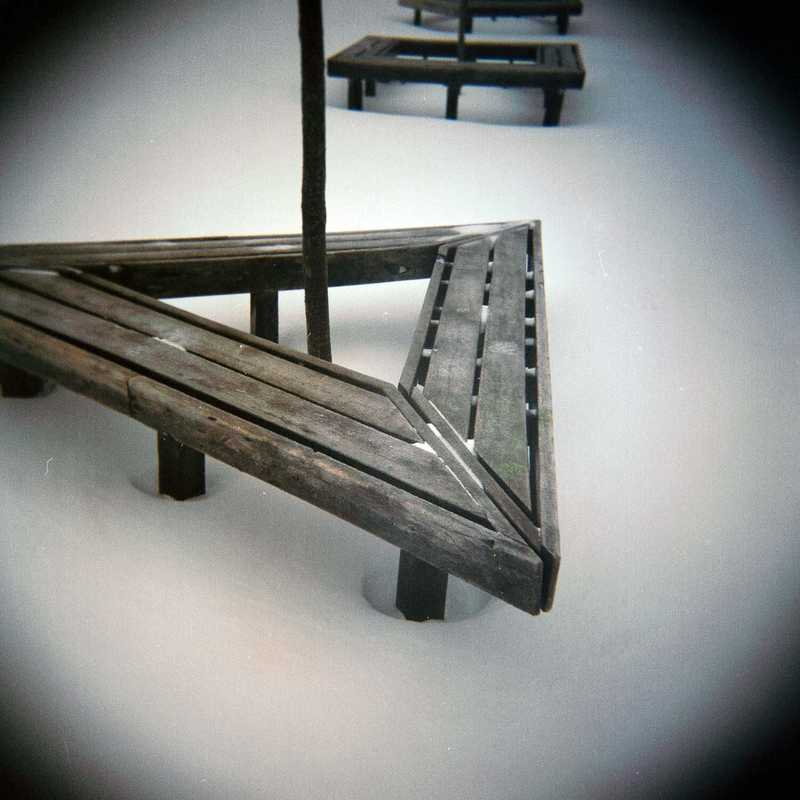 Abstract photo using a bench and snow